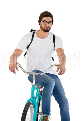 Handsome man posing with bicycle against white background