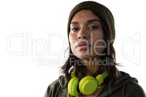 Portrait of confident young woman with headphones