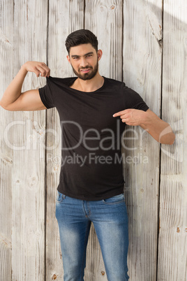 Portrait of man pointing at t-shirt