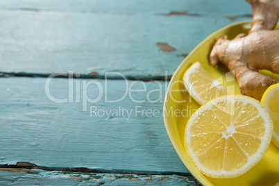 Lemon slices and ginger in plate