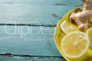 Lemon slices and ginger in plate