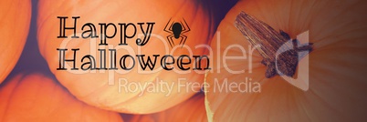 Happy Halloween text with pumpkins