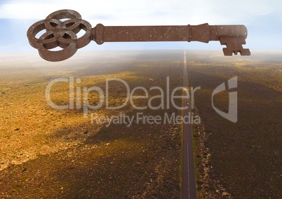 3D Rustic Key floating over barren landscape