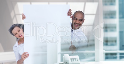 happy business couple with blank card in office