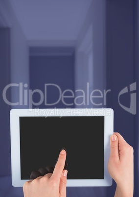 Hand holding tablet at home