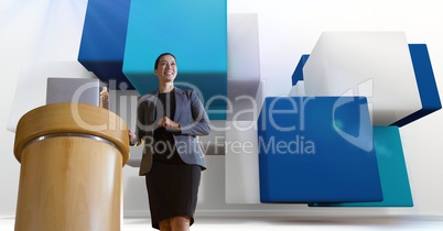 hero shot of female presenter against abstract 3d scene with cubes