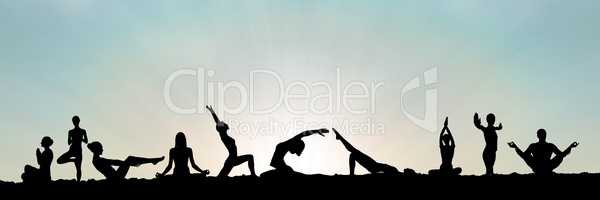 yoga group silhouette at sunset