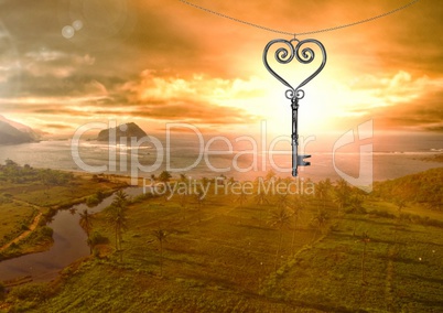 3D Heart Key floating over landscape and sunset