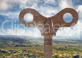 Rustic Key over rough barren landscape