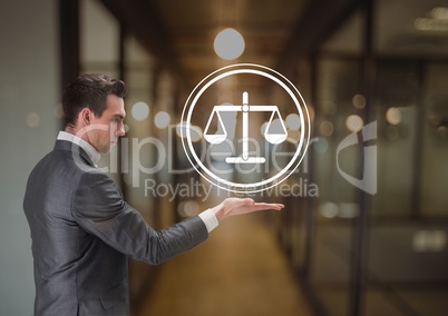 businessman holding justice icon