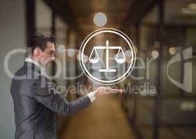 businessman holding justice icon