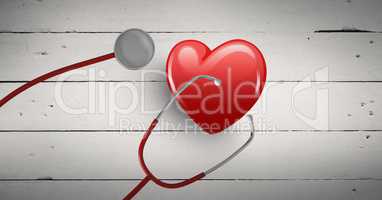 3d heart with stethoscope aginst bright wooden background