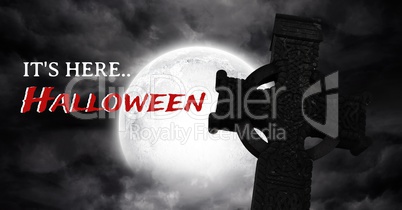 It's here Halloween text with gothic graveyard and moon