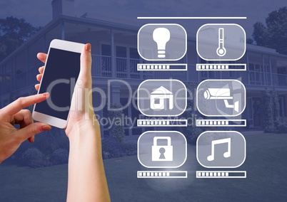 Hand holding phone with smart home interface at home