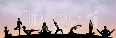 yoga group silhouette at sunset