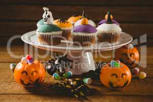 Cup cakes with decorations on table during Halloween