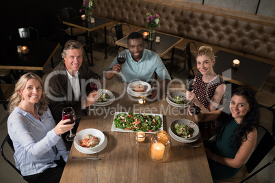 Overhead of happy friends dining together