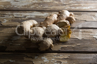 Close up of fresh gingers on damaged table