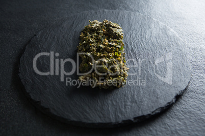 Close-up of cooked kale in slate on table