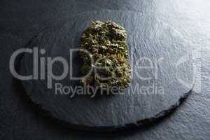 Close-up of cooked kale in slate on table