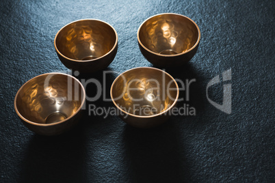 Golden steel bowls on table