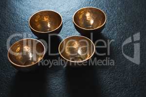 Golden steel bowls on table