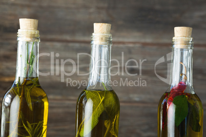 Olive oil bottles with herbal and spices