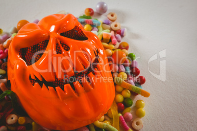 Close up of monster mask with various candies