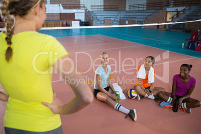 Smiling female players having a break