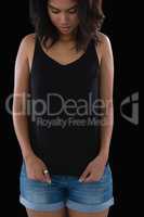 Woman stretching tank top against black background