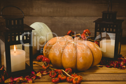 Pumpkins with candles on table during Halloween