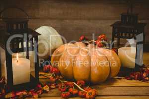 Pumpkins with candles on table during Halloween