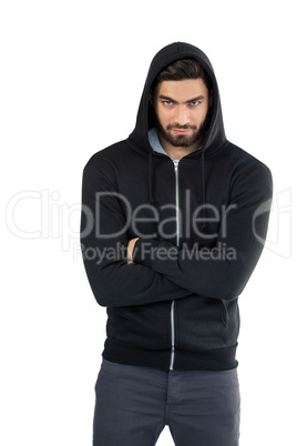 Handsome man posing with arms crossed against white background