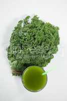 Overhead view of fresh kale with juice
