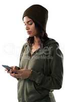 Woman using mobile phone against white background