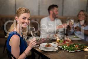 Portrait of beautiful woman having champagne