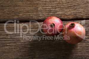 Pomegranates on a wooden table