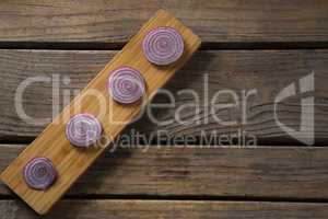Sliced onions on a wooden tray