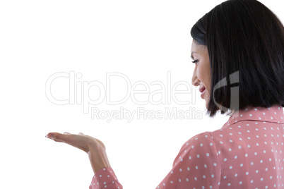 Woman pretending to hold an invisible object