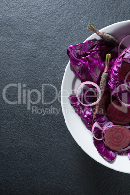 High angle view of vegetables in plate on slate