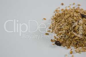 Crunchy granola scattered on white background