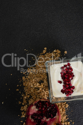 Yogurt with pomegranate slice and granola