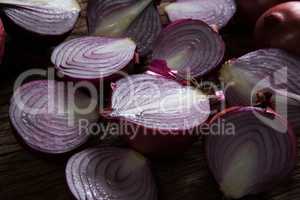 Halved onions on wooden table