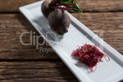 Beetroots in a tray on wooden table