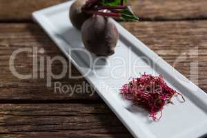 Beetroots in a tray on wooden table