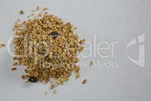 Crunchy granola scattered on white background
