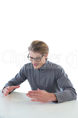 Businessman wearing eyeglasses while examining invisible product