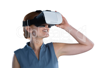 Happy young businesswoman wearing virtual reality glasses