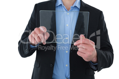 Mid section of businessman touching transparent glass interface