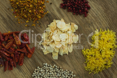 Various spices on wooden board